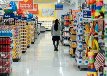 person standing between shelvings
