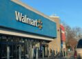 a walmart store with a car parked in front of it