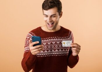 Portrait a happy young man dressed in sweater
