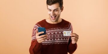 Portrait a happy young man dressed in sweater