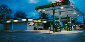 A gas station sits under the night sky.