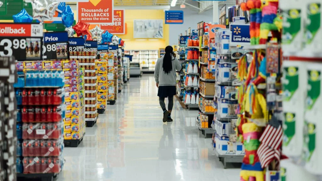 person standing between shelvings