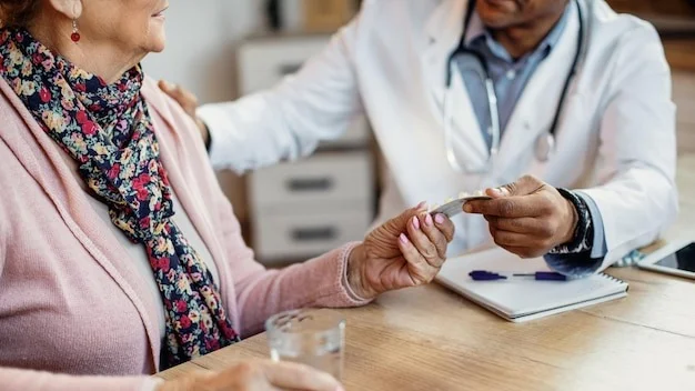 Closeup of a doctor giving pills to senior woman during home visit